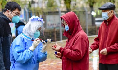 China eases Covid measures, trims quarantine time by two days