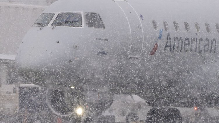FedEx, UPS warn severe winter storm could delay holiday packages, and airlines cut more flights